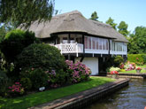 Home with garden beside a canal